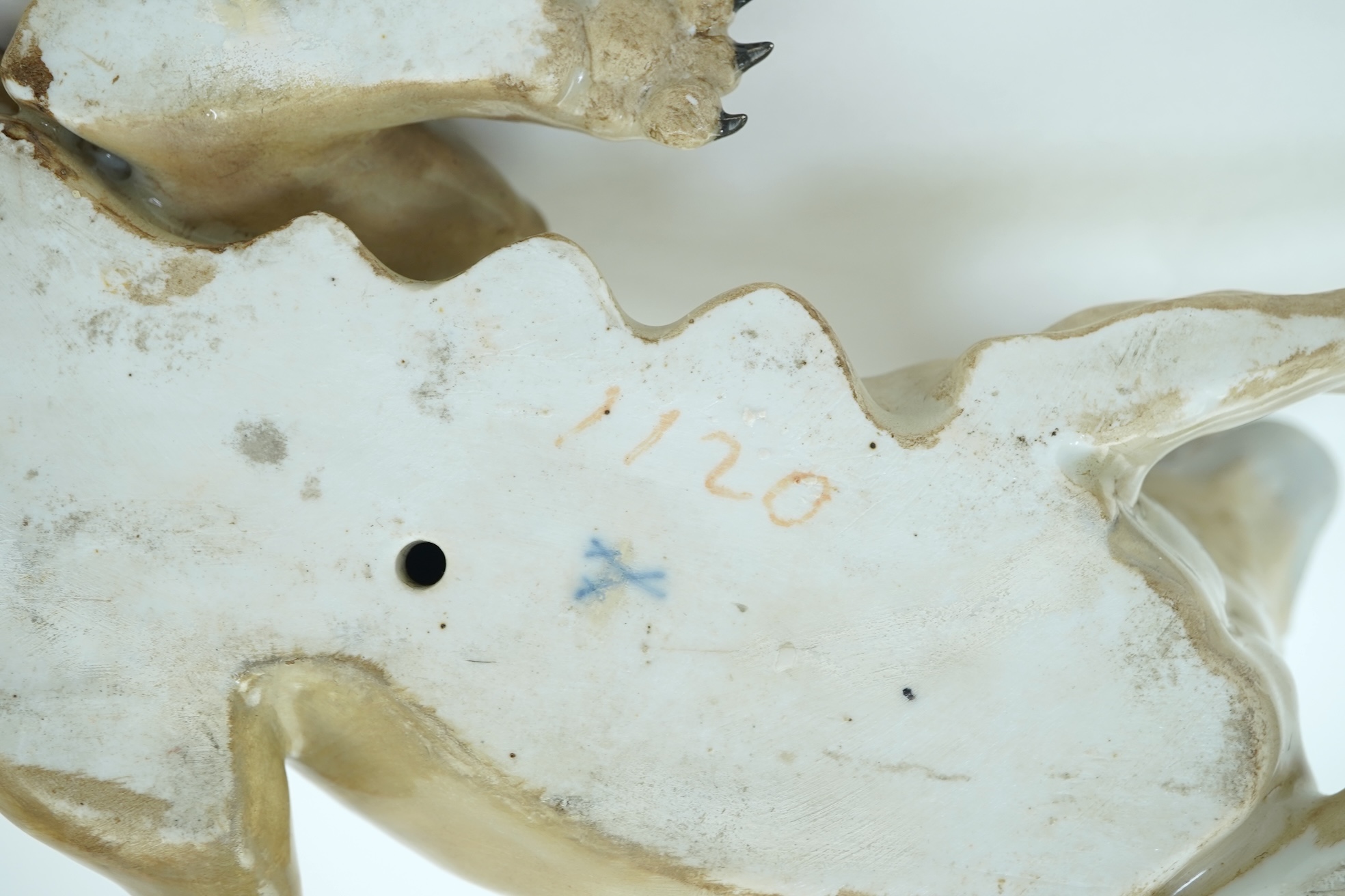 A Meissen model of a recumbent lioness, after J. J. Kandler, 19th century